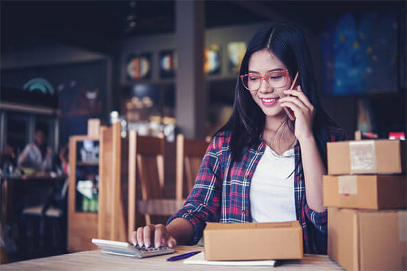 woman in glasses using smartphone